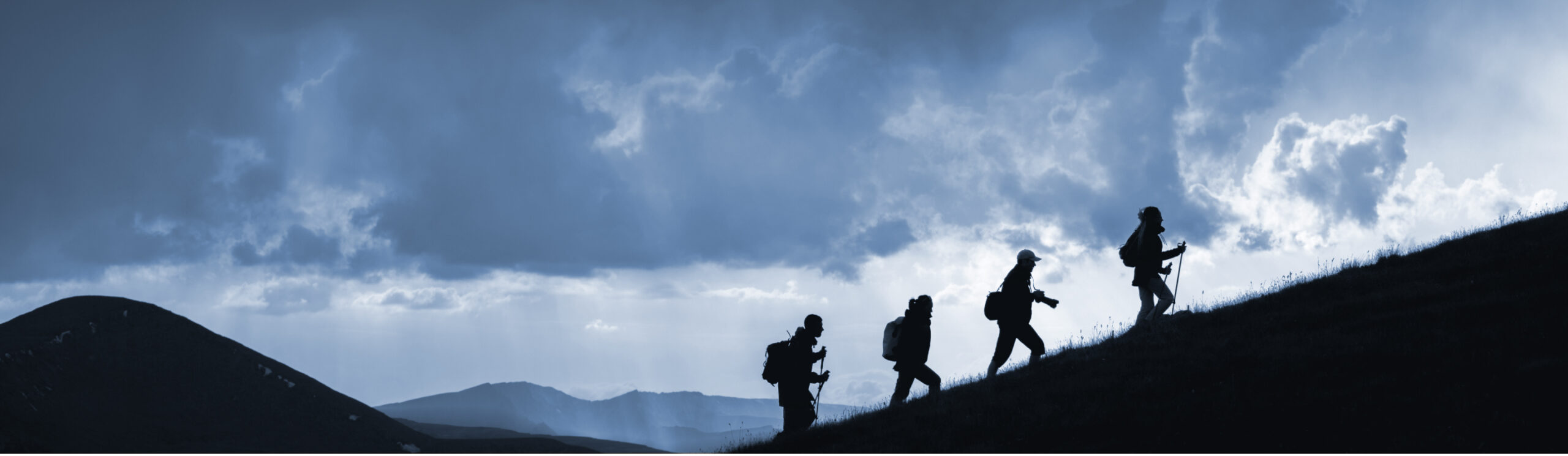 Group of people on a hike in the mountains together