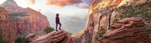 Woman on overlook after climbing a rock